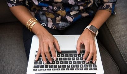 person typing on laptop
